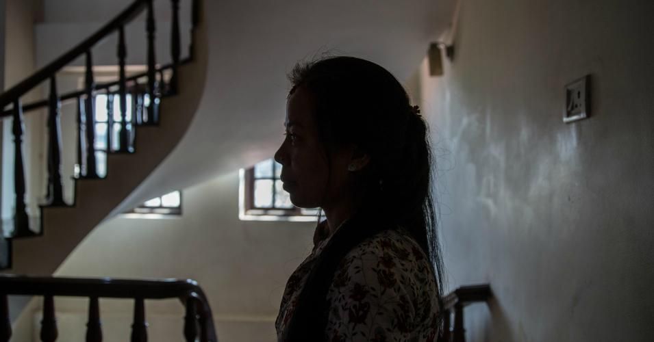 A resident of the Casa Nepal safe house stands in the upstairs common area on May 8, 2018 in Kathmandu, Nepal. The shelter houses approximately 60 women and their children annually. 