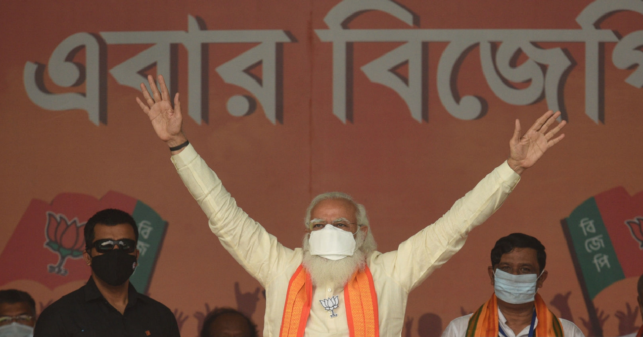 Prime Minister Narendra Modi gestures at the gathering during a public rally for West Bengal Assembly Election at Barasat on April 12, 2021 in North 24 Parganas, India. (Photo by Samir Jana/Hindustan Times via Getty Images)