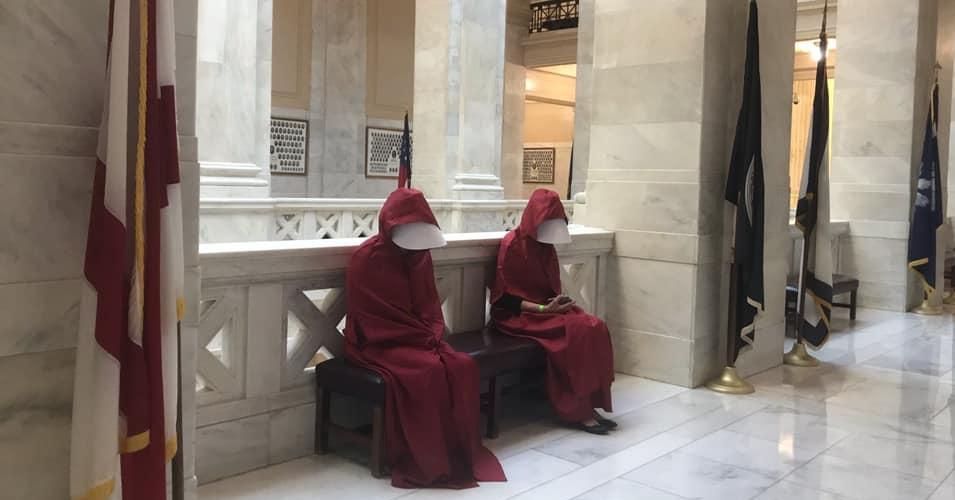 Opponents of an abortion ban in Arkansas protested at the statehouse Wednesday in outfits inspired by The Handmaid's Tale. (Photo: Arkansas Abortion Support Network/Facebook)