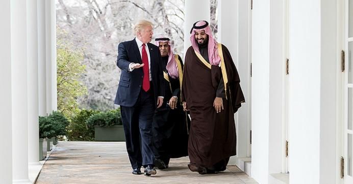 President Donald Trump walks with Mohammed bin Salman