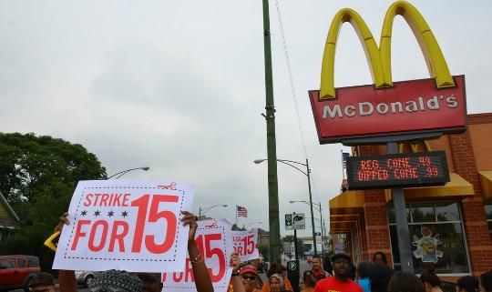Workers strike out side of a McDonald's (Photo via Flickr / Steve Rhodes / Creative Commons license)