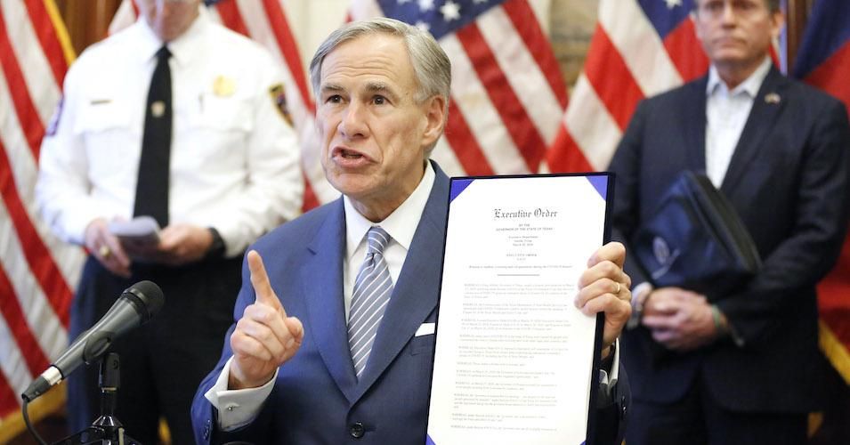 During a press conference at the Texas State Capitol in Austin, Texas Governor Greg Abbott holds an executive order stating that travel from other states will be limited and subject to 14-day self quarantine. 