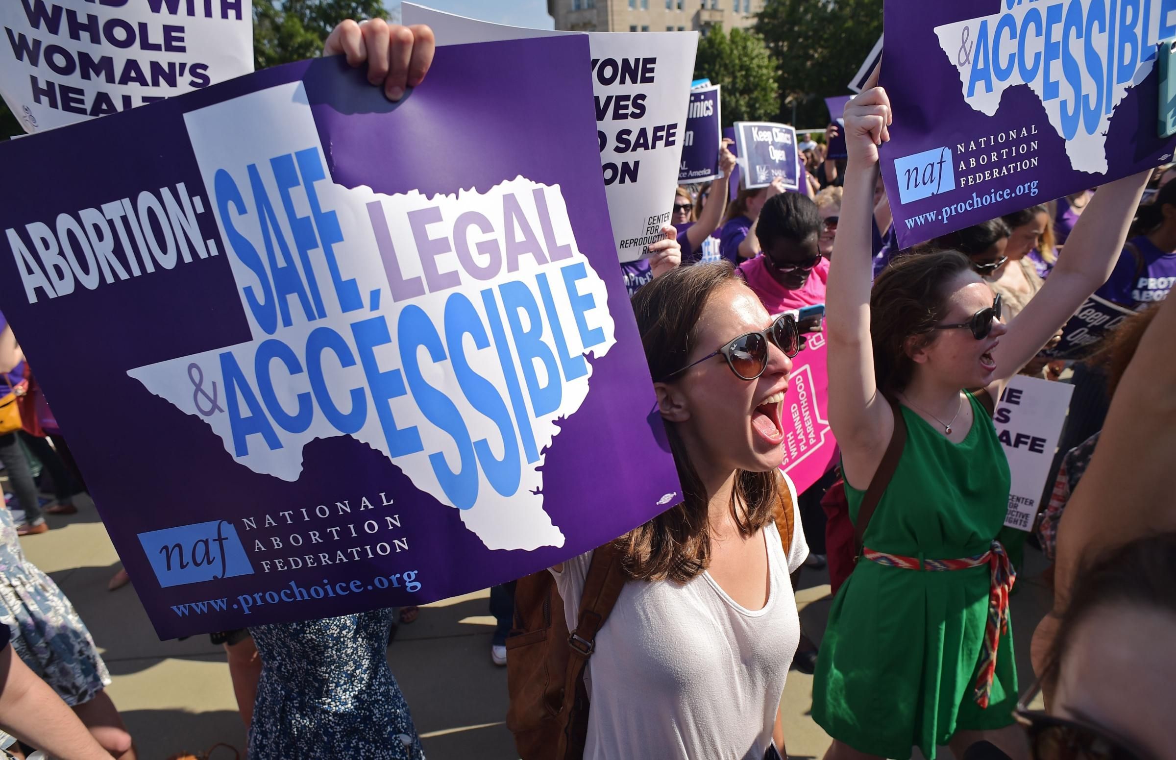 Reproductive rights activists hold placards and chant outside of the U.S. Supreme Court ahead of a ruling on abortion clinic restrictions on June 27, 2016 in Washington, D.C. (Photo: Mandel Ngan/AFP via Getty Images)
