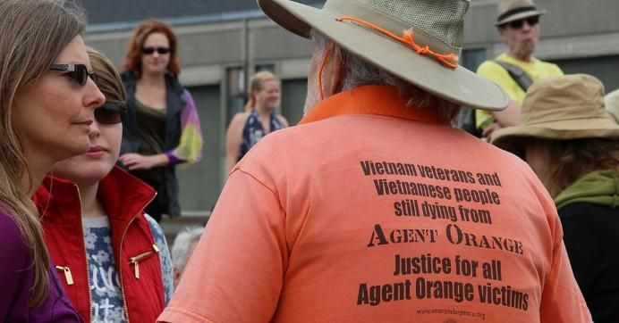 A man wears a shirt calling for justice for Agent Orange victims during the March Against Monsanto in San Francisco on May 23, 2015. 