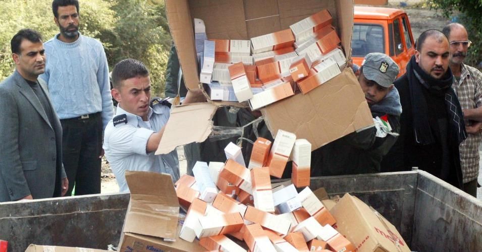 Palestinian customs officials dump Ahava products seized from West Bank shops during a 2009 boycott (Photo: Getty Images)