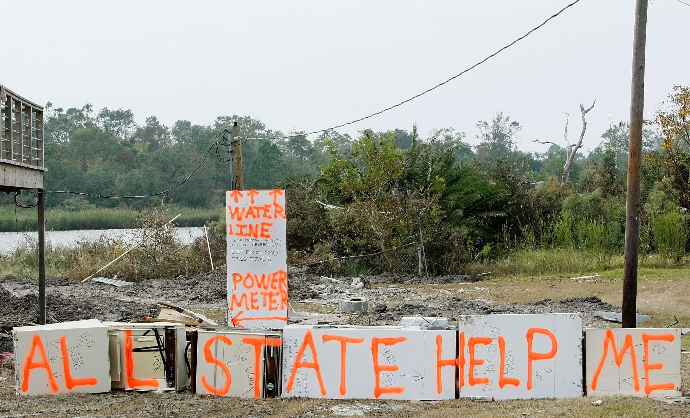 A sign painted on debris from Hurricane Ike reads "Allstate Help Me" on September 19, 2008 in Seabrook, Texas. (Photo: Mark Wilson via Getty Images)