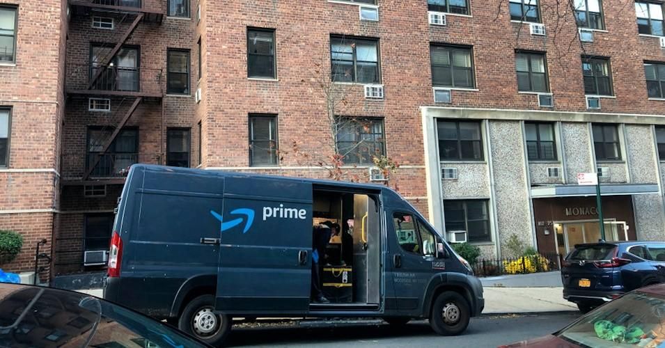 An Amazon Prime delivery van stops at an apartment building in Forest Hills, Queens, New York City. (Photo: Lindsey Nicholson/Education Images/Universal Images Group via Getty Images)
