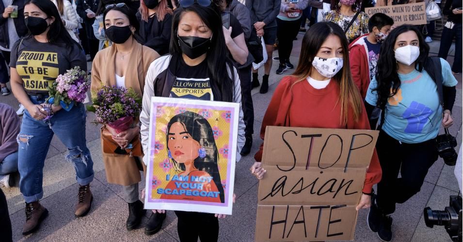 Demonstrators wearing face masks and holding signs take part in a rally "Love Our Communities: Build Collective Power" to raise awareness of anti-Asian violence, at the Japanese American National Museum in Little Tokyo in Los Angeles, California, on March 13, 2021. (Photo: Ringo Chiu/AFP via Getty Images)