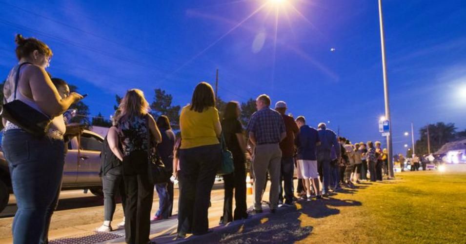 Voters wait in line to cast their ballots at Pilgrim Evangelical Lutheran Church in Mesa, Arizona. Lines in the evening were around three hours. (Photo: Michael Chow/The Republic)