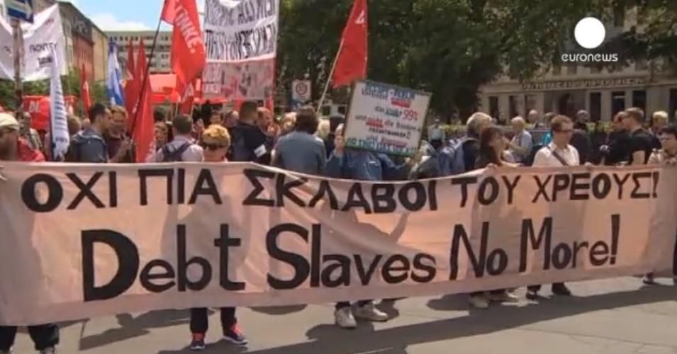 Demonstrators in Berlin called on European lenders to end their "slavery" of indebted Greece. (Screenshot: Euronews)