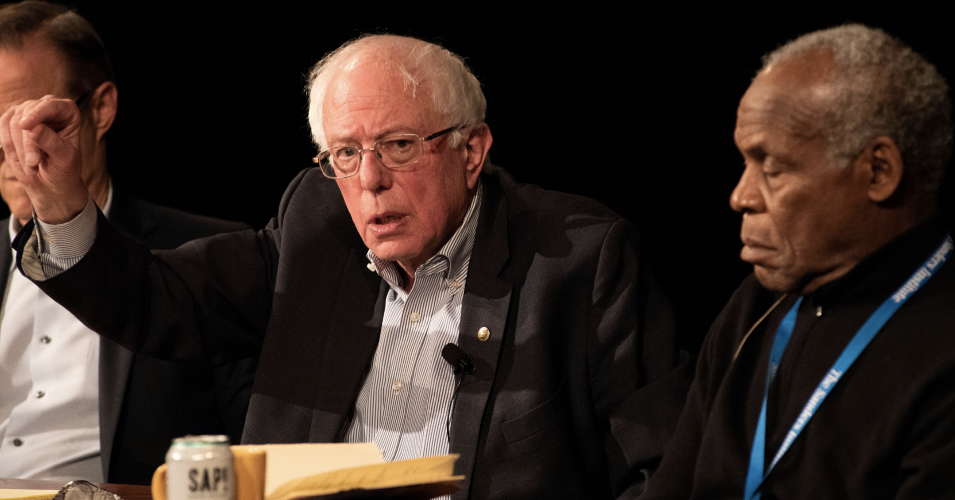 Sen. Bernie Sanders (I-Vt.), center, sitting next to Michael Weinstein, president and co-founder of the AIDS Healthcare Foundation (l) and actor and activist Danny Glover at a panel on the crisis of housing during The Sanders Institute Gathering on Saturday, December 1, 2018. (Photo: Will Allen 2018 / @willallenexplore)