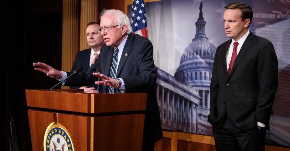  Sen. Bernie Sanders (I-Vt.), flanked by Sens. Mike Lee (R-Utah) and Chris Murphy (D-Conn.), speaks after the Senate voted to withdraw support for Saudi Arabia's war in Yemen on December 13, 2018.