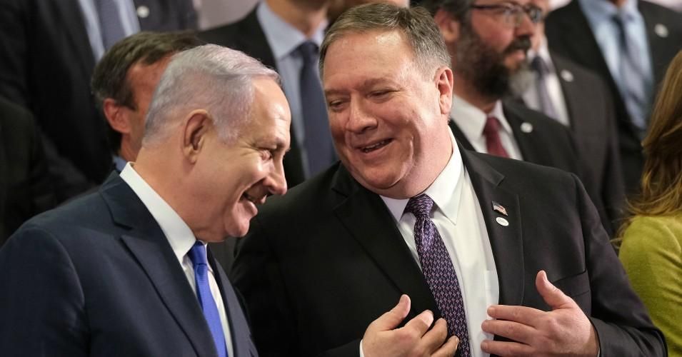 U.S. Secretary of State Mike Pompeo (R) and Israeli Prime Minister Benjamin Netanyahu talk during the group photo at the Ministerial to Promote a Future of Peace and Security in the Middle East on February 14, 2019 in Warsaw, Poland. (Photo: Sean Gallup/Getty Images)
