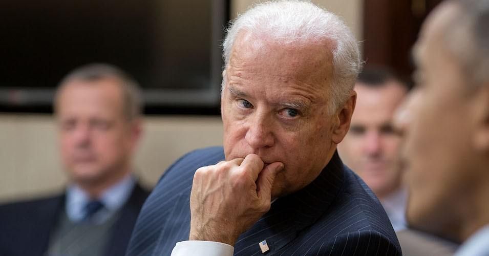 Then-Vice President Joe Biden listens to former President Barack Obama during a meeting in the Situation Room of the White House, Feb. 2, 2015.