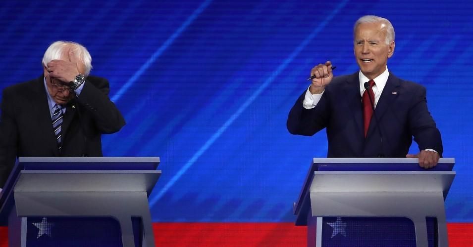 Democratic presidential candidate Sen. Bernie Sanders listens as former Vice President Joe Biden speaks during the Democratic Presidential Debate at Texas Southern University's Health and PE Center on September 12, 2019 in Houston, Texas. 