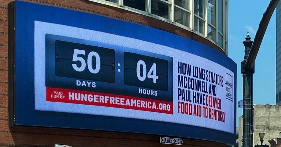 A billboard calls out Sens. Mitch McConnell and Rand Paul, both Republicans from Kentucky, for blocking $16 billion in food aid Americans, including nearly $133 for Kentuckians. 