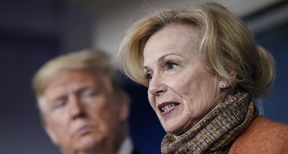 Former US President Donald Trump looks on as White House Coronavirus Response Coordinator Dr. Deborah Birx speaks about the coronavirus outbreak in the press briefing room at the White House on March 17, 2020 in Washington, DC