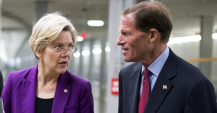Sens. Elizabeth Warren (D-Mass.) and Richard Blumenthal (D-Conn.) talk as they walk to the Senate Democrats' caucus lunch on Thursday, July 11, 2013. 