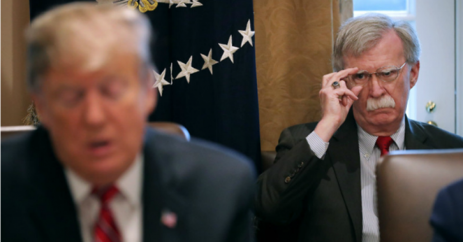 National security advisor John Bolton listens to President Donald Trump talk to reporters during a cabinet meeting at the White House in Washington on Feb. 12. 