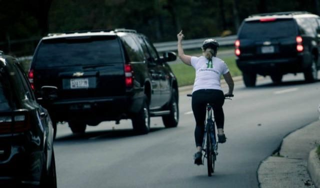 The iconic shot of Juli Briskman giving the Trump motorcade the finger in October 2017.