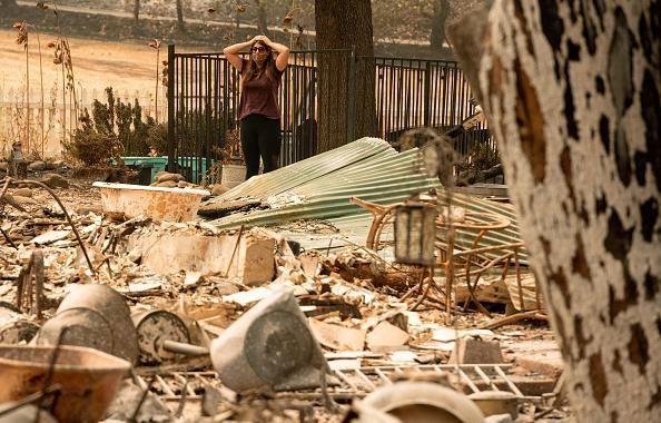 Resident Alyssa Medina reacts while looking over the charred remains of her family home during the LNU Lightning Complex fire in Vacaville, California on August 23, 2020. (Photo: Josh Edelson/AFP via Getty Images)