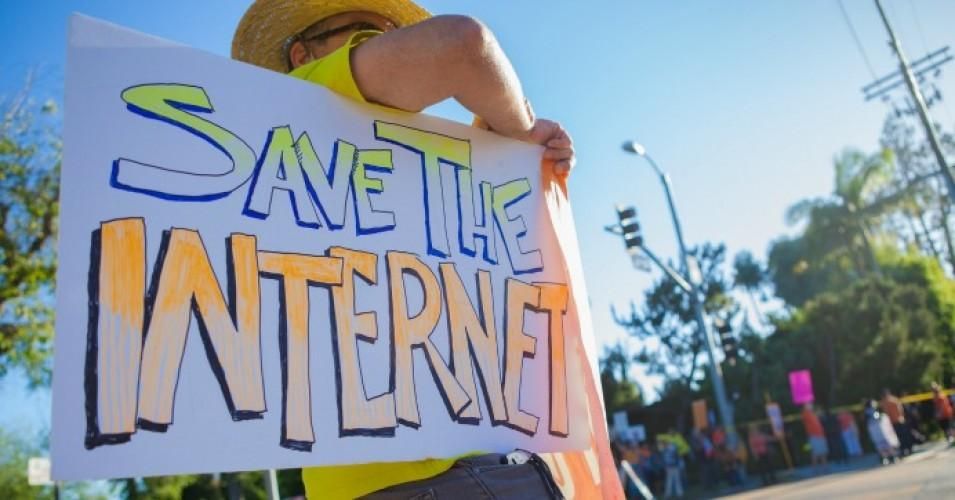 Sign reads: Save the internet