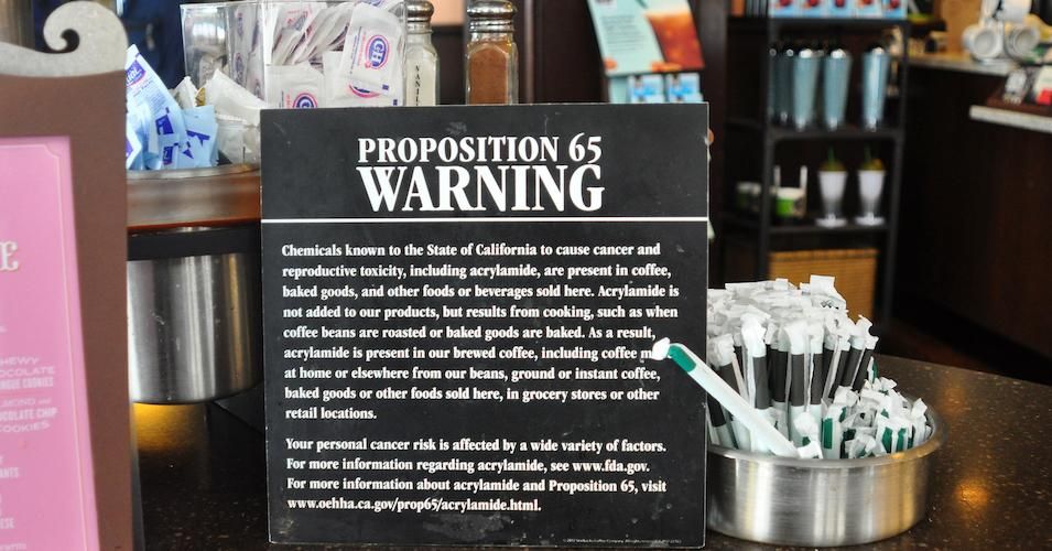 A sign in a San Francisco Starbucks coffee shop warns customers that coffee and baked goods sold at the shop and elsewhere contain acrylamide, a chemical known to cause cancer and reproductive toxicity. The proposition is a California law passed by voters in 1986. 