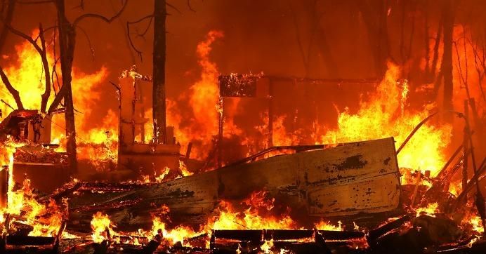 A home burns as the Camp Fire moves through the area on November 9, 2018 in Magalia, California. Fueled by high winds and low humidity, the rapidly spreading Camp Fire ripped through the town of Paradise and has quickly charred 70,000 acres and has destroyed numerous homes and businesses in a matter of hours. (Photo: Justin Sullivan/Getty Images)