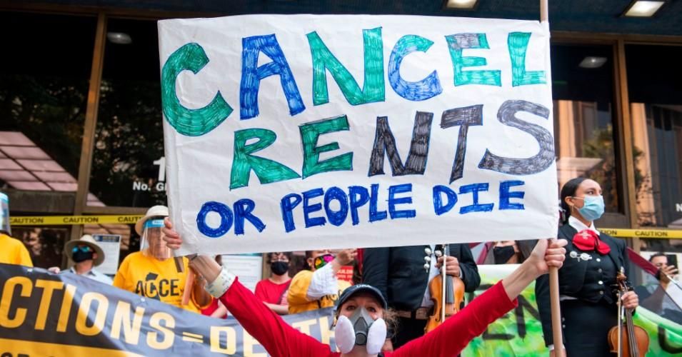 Sign says "Cancel rent or people die"