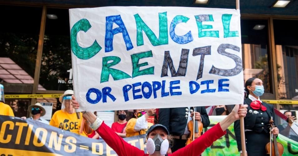 "For the 12 million Americans who are behind an average of $5,000 each on rent, even an eviction moratorium is not enough," over 200 national and community groups say in a new ad calling for housing debt cancellation published at USA Today says. (Photo: Valerie Macon/AFP via Getty Images)