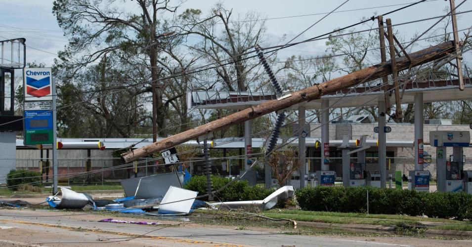 A large power line lies across a Chevron gas station following the passage of Hurricane Laura through Lake Charles, Louisiana on August 27, 2020. (Photo: Andrew Caballero-Reynolds/AFP via Getty Images)