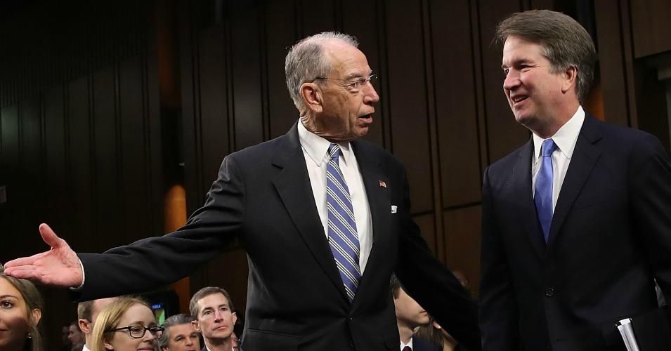 Senate Judiciary Committee Chairman Chuck Grassley (L) (R-IA) leads Supreme Court nominee Judge Brett Kavanaugh (R) to the witness table at the beginning of Kavanaugh's second day of his confirmation hearing on Capitol Hill September 5, 2018 in Washington, DC. 