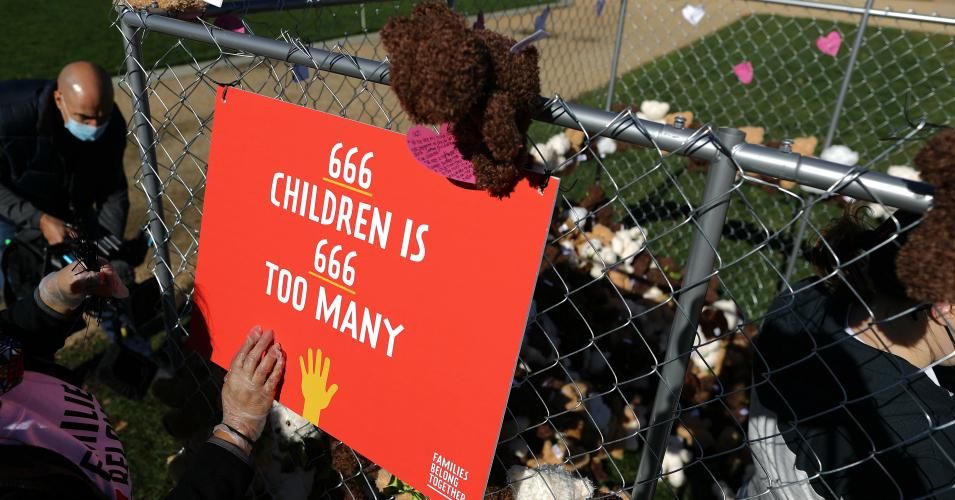 Volunteers from pro-immigration group Families Belong Together build and fill a chainlink cage with about 600 teddy bears 'representing the children still separated as a result of U.S. immigration policies' on the National Mall November 16, 2020 in Washington, D.C.