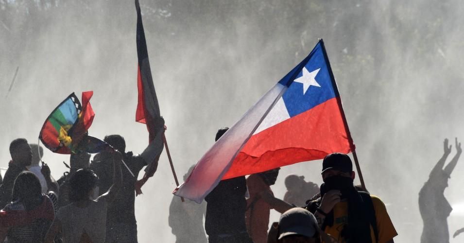 Chileans in the country's streets marked a victory on Friday as the government agreed to hold a referendum on replacing the dictatorship-era constitution. 