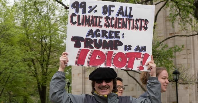 March for Science demonstrator holds sign denouncing Trump