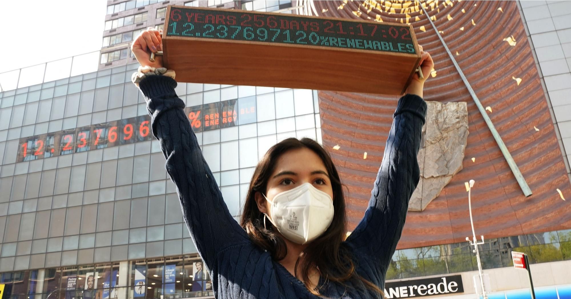 Climate campaigner Xiye Bastida holds a version of the Climate Clock—which shows the time remaining for policymakers to reduce emissions before the effects of the climate crisis become irreversible—in New York City's Union Square on April 19, 2021. (Photo: Timothy A. Clark/AFP via Getty Images) 