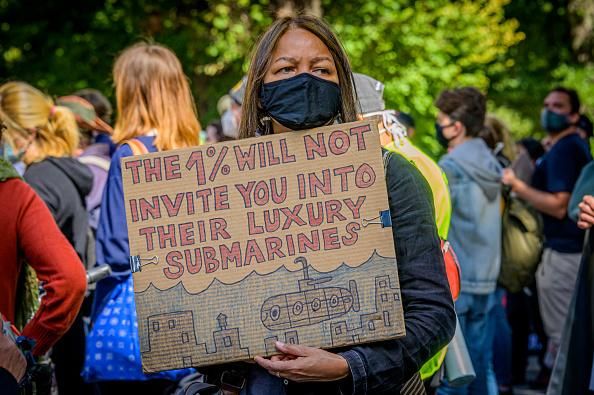 Participant holding a sign at a climate justice march in New York City on September 20, 2020. (Photo: Erik McGregor/LightRocket via Getty Images)