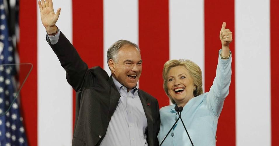 Vice presidential candidate Sen. Tim Kaine waves with his presidential running mate Hillary Clinton after she introduced him during a campaign rally in Miami on July 23. (Photo: Scott Audette/ Reuters) 