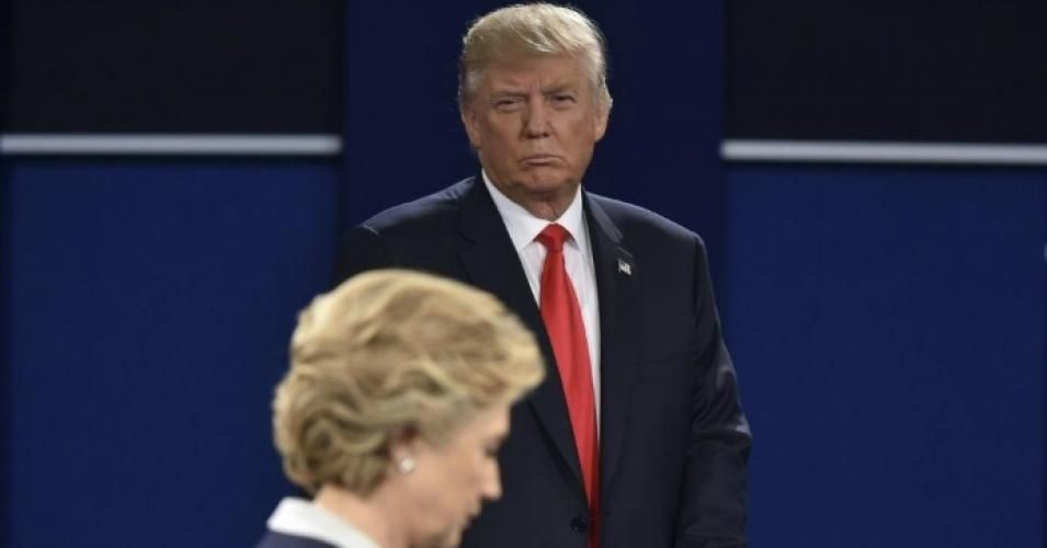 Republican presidential candidate Donald Trump listens to Democratic presidential candidate Hillary Clinton during the second presidential debate at Washington University in St. Louis, Missouri on October 9, 2016. (Photo: Paul J. Richards /AFP/Getty Images)