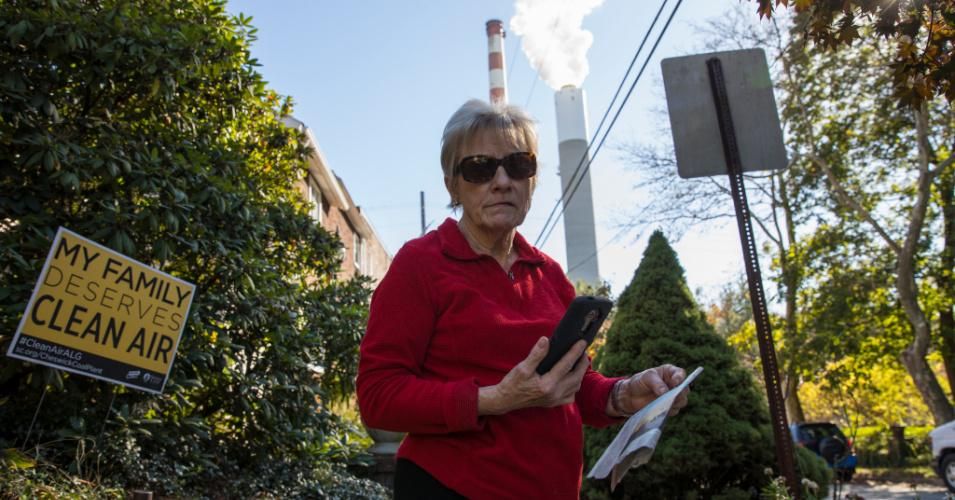 Marti Blake stands next to her home, left, and in view of the smokestack of the Cheswick coal-fired power plant on October 27, 2017 in Springdale, Pennsylvania. Blake complains about the amount of pollution from sulphur-dioxide, nitrogen oxide, and coal particles originating from the NRG-owned 565-MW power plant that has affected her health as well as those in the surrounding area. (Photo: Robert Nickelsberg/Getty Images)