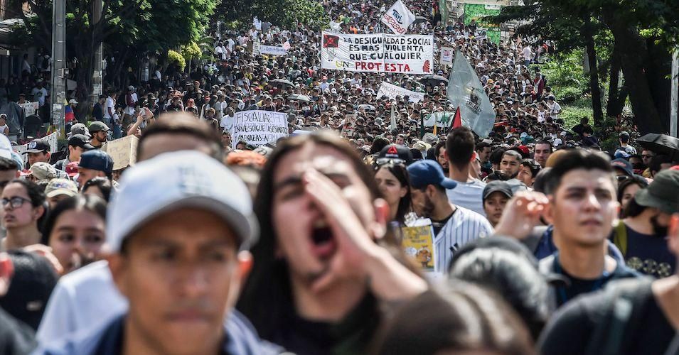 People march during a nationwide strike called by students, unions and indigenous groups to protest against the government of Colombia's President Ivan Duque in Medellin, Colombia, on November 21, 2019.