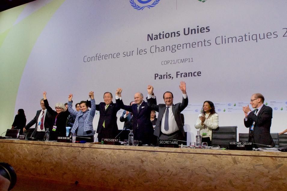 Heads of state cheer after the Paris Climate Change Agreement was signed at COP21, 2015, by 197 parties