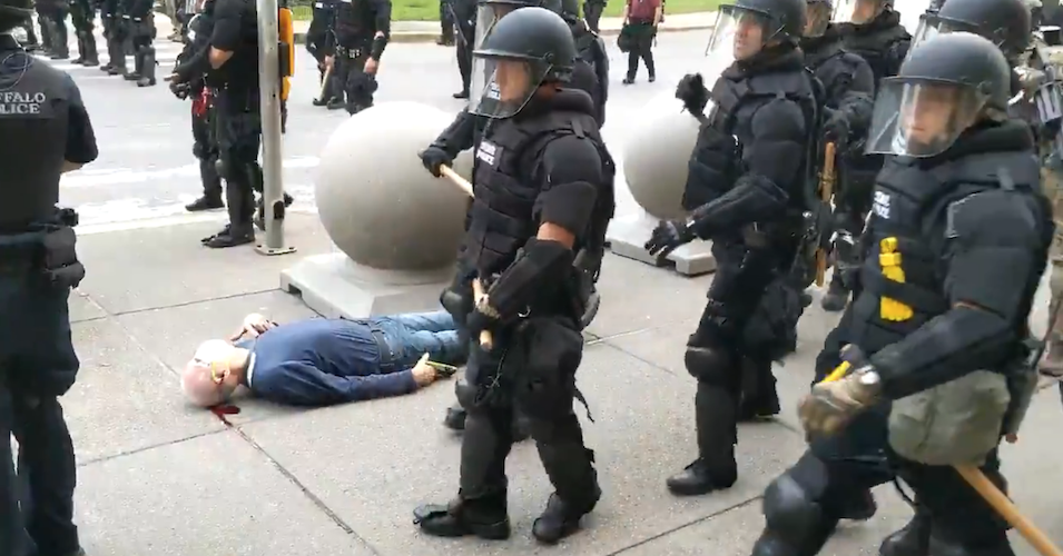 Police officers in Buffalo, New York walk by the motionless body of 75-year-old Martin Gugino as he bleeds from his ear after being attack attacked by officers during a protest on June 5, 2020. (Photo: Screengrab/WBFO)