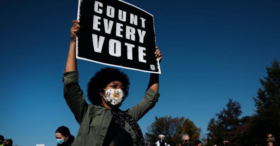 A protester holds up a sign at a Protect the Results Coalition rally in Philadelphia on November 4, 2020. (Photo: Spencer Platt/Getty Images) 