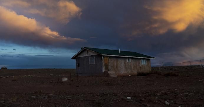 Storm clouds pass over one of many rural homes on the Navajo reservation which do not have electricity or running water during the coronavirus pandemic on March 27, 2020 in Cameron, Arizona.