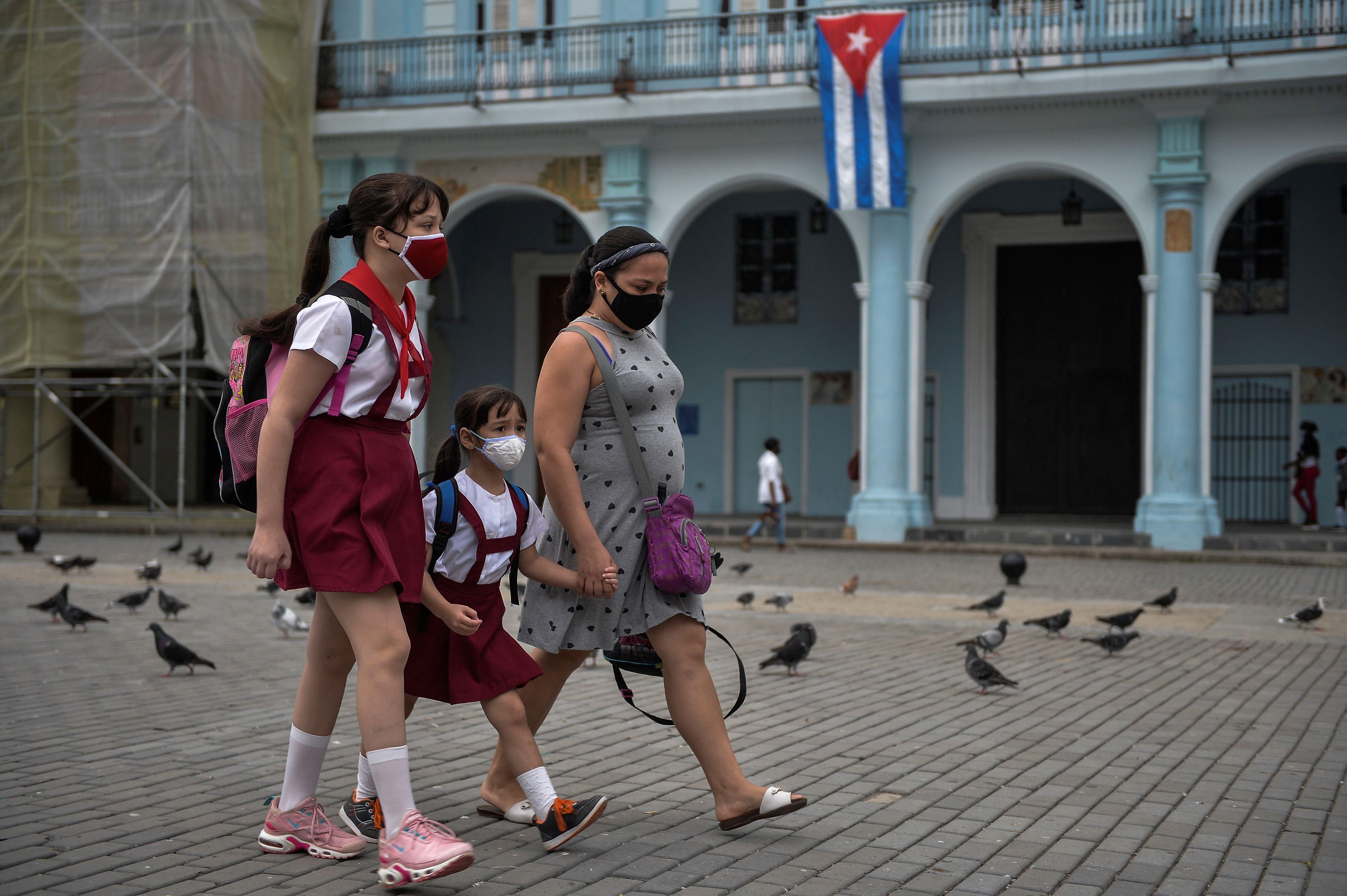 Children walk to school in Havana, Cuba on January 13, 2021. (Photo: YAMIL LAGE/AFP via Getty Images)