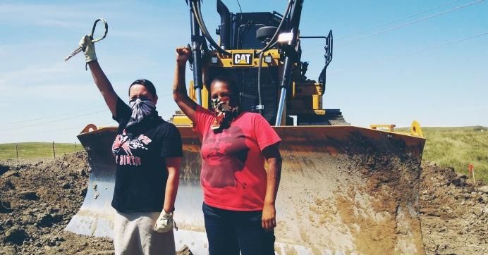 Tribal women on Monday stormed the Dakota Access Pipeline site and halted construction. The pipeline company's lawsuit has not deterred the ongoing civil disobedience campaign. (Photo: Unicorn Riot)