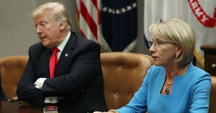 President Donald Trump and Education Secretary Betsy DeVos take part in a roundtable in the Roosevelt Room at the White House on December 18, 2018 in Washington, D.C. 