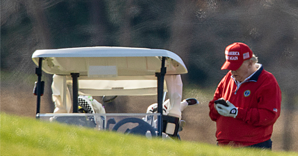 President Donald Trump makes a phone call as he golfs at Trump National Golf Club on November 26, 2020 in Sterling, Virginia.