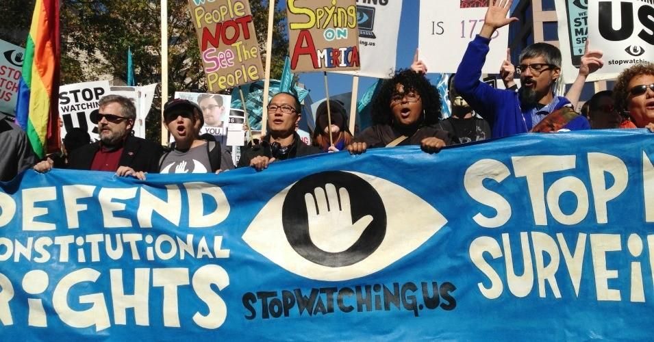 Protesters carried signs at a march against mass surveillance on Oct. 26, 2013 in Washington, D.C.